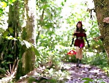 Little Red Riding Hood walking alone in the forest