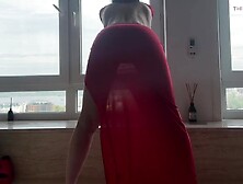 yoga in taut transparent red suit