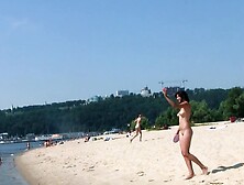 Bombastic young nudist babes sunbathe nude at the beach