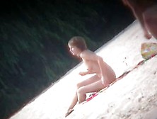 Hot body babe lying down on the beach surprised by a