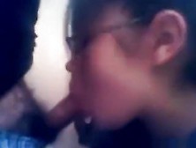 Nerdy glassed asian girl gives her bf a blowjob in the toilets during lunch break