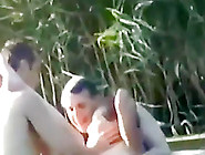 tapes a slut having a threesome with 2 guys in the lake