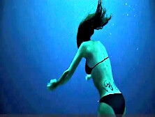 Teresa Palmer gets down and dirty in the sun with her bikini on!