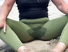 Milf Practices Yoga On Beach And Wets Her Pants For A Thrilling Public Experience