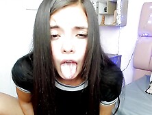 Salome Colucci,  an innocent-looking college student,  stimulates her pussy over her thong with a vibrator while enjoying