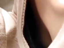 Look down her sweater to see her sexy nipples