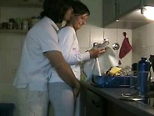 Couple having sex in kitchen