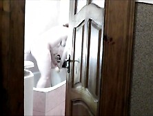 Bare woman hot blond in bath.  Pervert guy roommate in short T shirt out of pants this watches outside,  masturbate knob and cum.