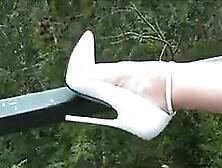 Very Tall And White High Heels Outdoors