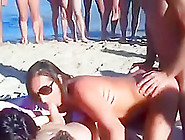 Amateur swingers on the nudist beach having groupsex