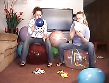 2 Girls Popping Balloons